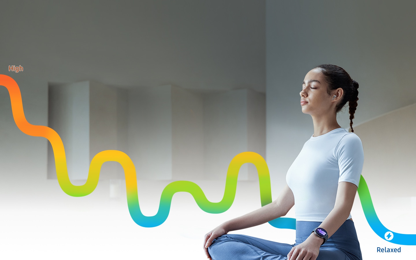 Person is meditating with Galaxy Buds3 Pro in the ear. Graph is up high on the left and flows downward to the right, while showing fluctuations. On the very left is text High. On the very right is Stress feature icon and the text Relaxed.